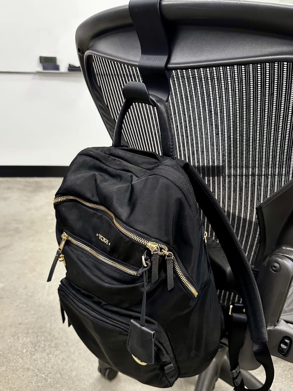 Backpack on hanger on Herman Miller Aeron office chair Backpack on hanger on Herman Miller Aeron office chair
