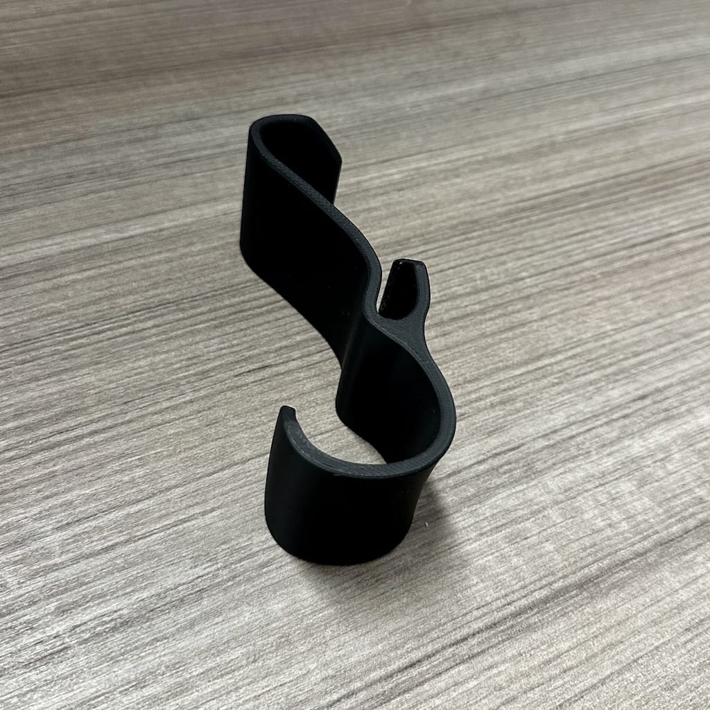 Close-up of uninstalled backpack/bag hanger on desk Close-up of uninstalled backpack/bag hanger on desk