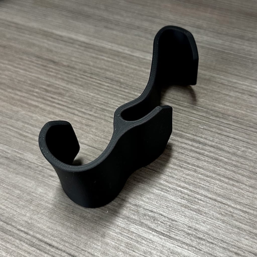 Close-up of uninstalled backpack/bag hanger on desk Close-up of uninstalled backpack/bag hanger on desk