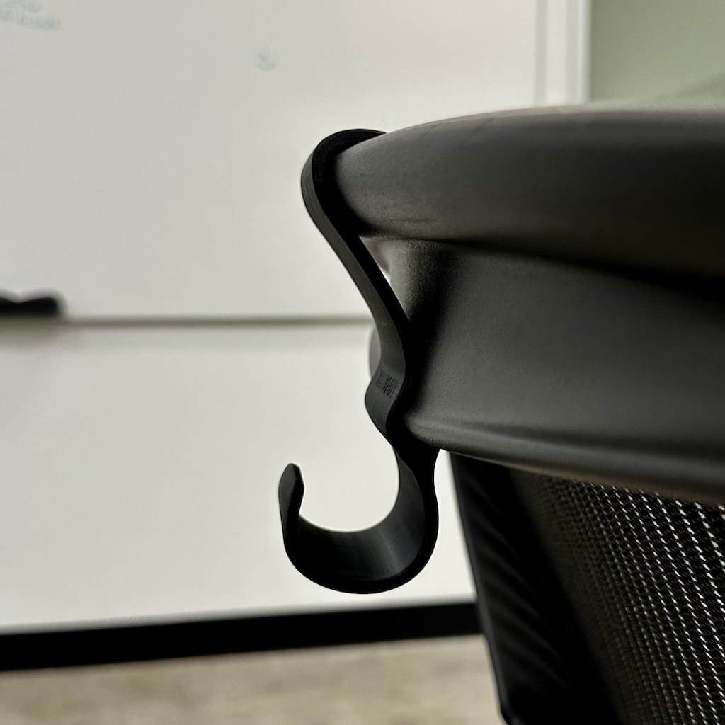 Profile of backpack/bag hanger on Herman Miller Aeron office chair Profile of backpack/bag hanger on Herman Miller Aeron office chair